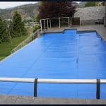 Thermal pool cover installed on a backyard pool in North America, reducing heat loss and evaporation